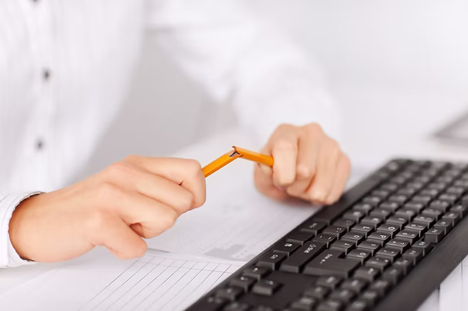 breaking pencil in hands