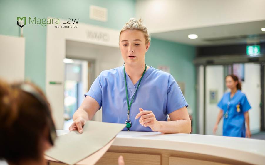 NHS nurses at a nurses station in a hospital.