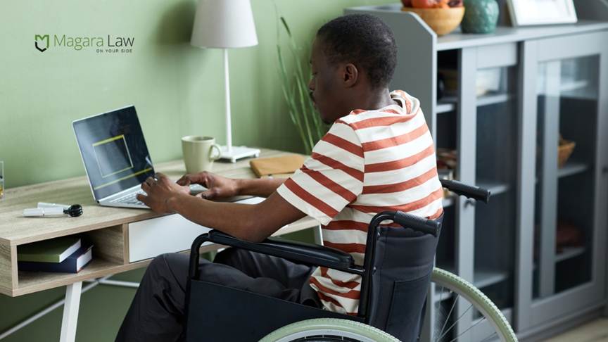 A remote working disabled person in a wheelchair working from home.