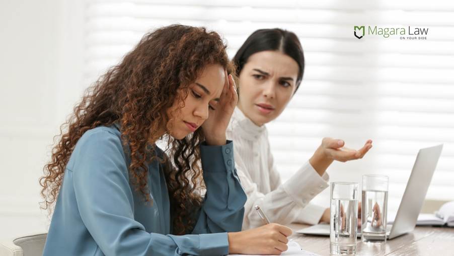 A woman engaged in micro-bullying toward another woman while at work.